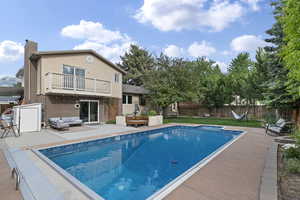 View of pool with outdoor lounge area and a patio area