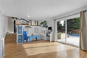 Sliding door in family room, leading to outdoor living area and swimming pool.