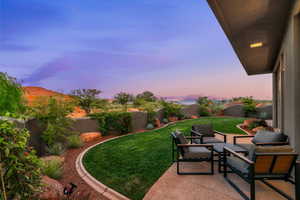 Fenced backyard featuring a patio area
