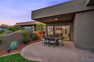 Patio terrace at dusk with a patio and outdoor dining area