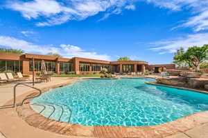 Community pool with a patio