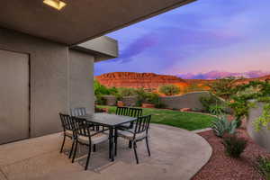 Fenced backyard featuring a patio area and outdoor dining space