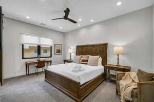 Carpeted bedroom featuring recessed lighting and ceiling fan