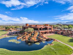 Bird's eye view of a water and mountain view and a golf club