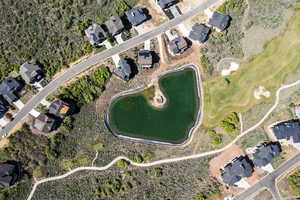 Aerial view of property's location featuring nearby suburban area and a local golf course