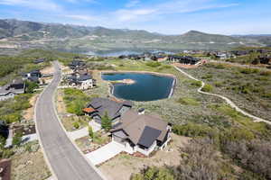 Aerial perspective of suburban area featuring a water and mountain view