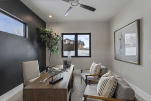 Carpeted home office with a ceiling fan, baseboards, and recessed lighting