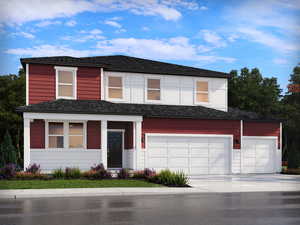 Traditional-style house featuring driveway and a garage