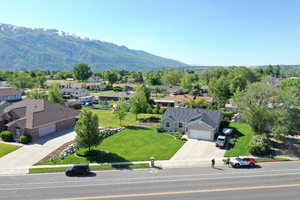 Aerial view of residential area featuring a mountainous background