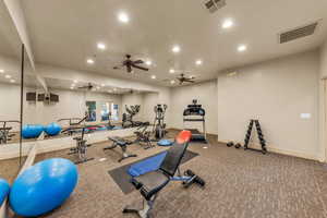 Gym with recessed lighting, baseboards, carpet flooring, and ceiling fan