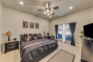 Bedroom featuring light carpet, baseboards, recessed lighting, and ceiling fan