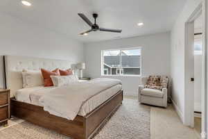 Bedroom with light carpet, recessed lighting, a ceiling fan, and baseboards