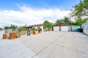 Detached garage featuring a gate