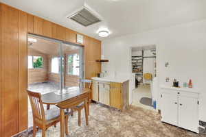 Kitchen with wood walls and light countertops