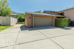 View of front of house featuring driveway, an attached garage, and a mountain view