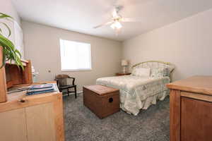 Bedroom featuring carpet floors and ceiling fan