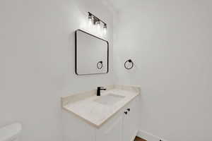 Bathroom right outside the kitchen