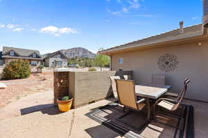 View of patio featuring a mountain view and outdoor dining area
