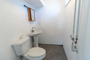 Bathroom in the basement bedroom it's plumbed in the wall for a shower