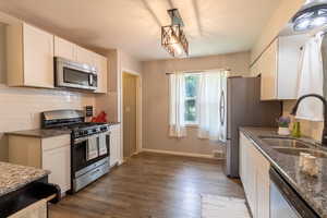 Kitchen with stainless steel appliances and gas stove