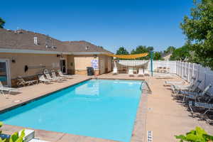 Community pool featuring a patio area