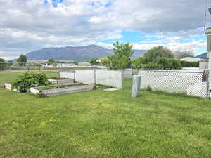 View of yard featuring a mountain view and a garden