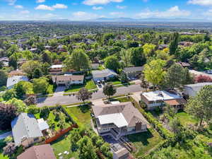 Aerial perspective of suburban area featuring a mountain backdrop
