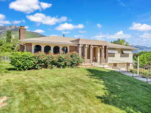 Back of property featuring a chimney and a mountain view
