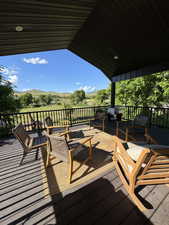 Wooden terrace featuring a mountain view