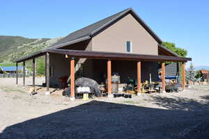 View of side of property with a mountain view