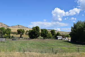 View of yard featuring a view of countryside and a mountain view