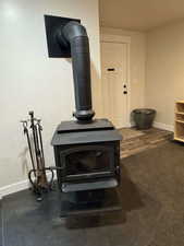 Detailed view of a wood stove and baseboards