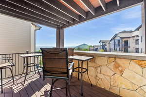 Wooden terrace featuring a residential view