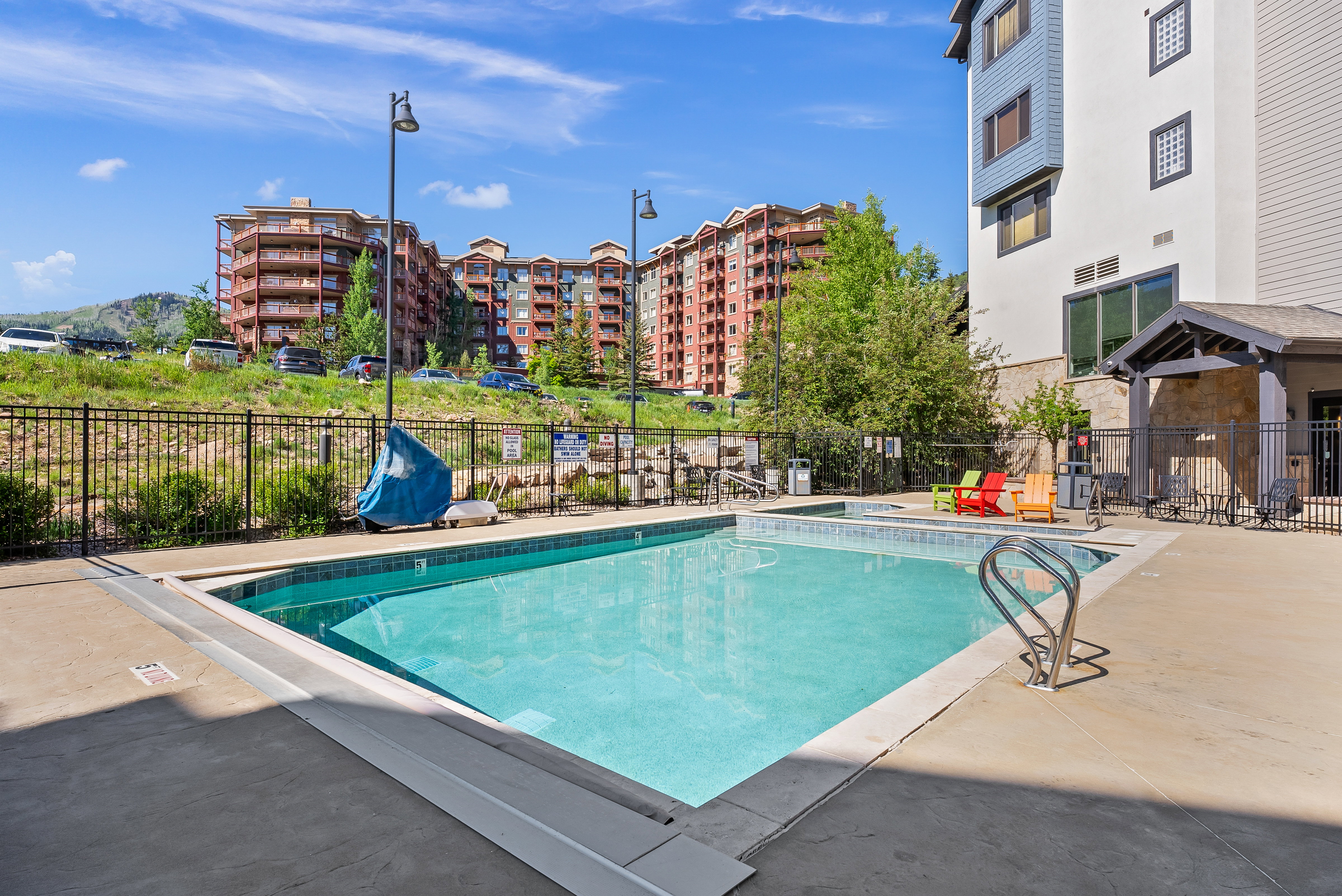 Community pool featuring a patio
