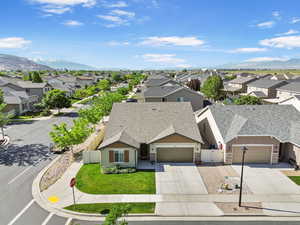 Aerial perspective of suburban area featuring a mountain backdrop