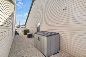 View of side of property with central AC