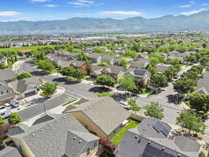 Aerial perspective of suburban area with a mountainous background