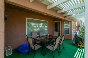 View of patio / terrace with a pergola and outdoor dining area