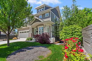 Traditional style home featuring driveway and an attached garage