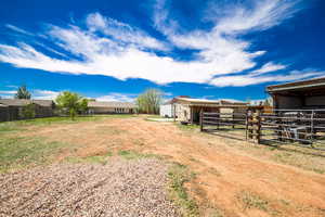 View of yard featuring an exterior structure and an outbuilding
