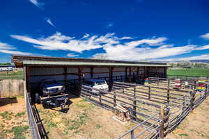 View of outdoor structure with an exterior structure, a carport, and a view of countryside