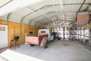 Garage featuring metal wall