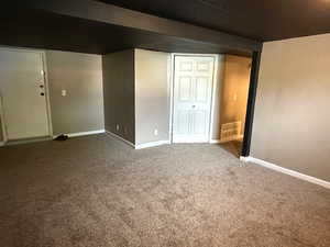 Finished basement featuring carpet and baseboards