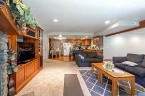 Living room featuring light carpet and recessed lighting