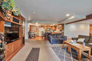 Living area with recessed lighting and baseboards