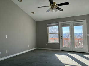 Primary bedroom, a ceiling fan, and vaulted ceiling