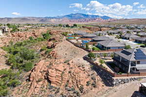 Aerial view of residential area featuring a mountainous background
