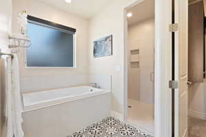 Full bathroom featuring a shower stall, a bath, tile patterned floors, baseboards, and recessed lighting