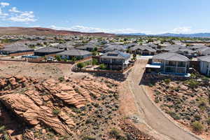 Aerial view of residential area featuring a mountainous background