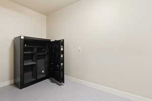 Unfurnished bedroom featuring baseboards and speckle patterned floor